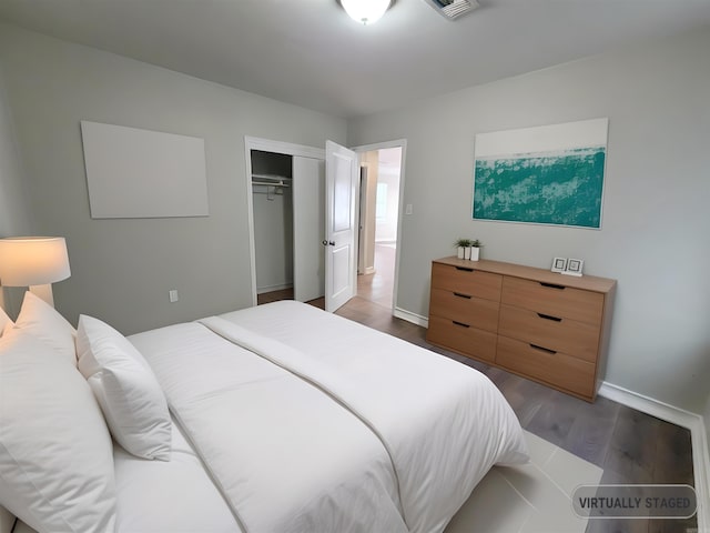 bedroom featuring a closet and dark wood-type flooring