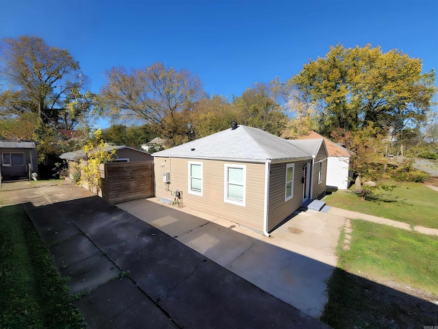 view of home's exterior featuring a garage and an outdoor structure