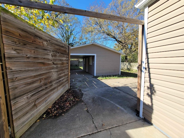 view of patio featuring a storage unit