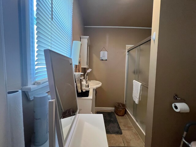 bathroom with vanity, tile patterned floors, and walk in shower