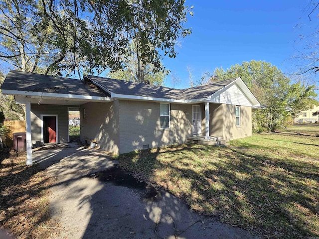 1903 W 24th Ave, Pine Bluff, AR 71603 - view of home's exterior with a yard, an attached carport, and brick siding