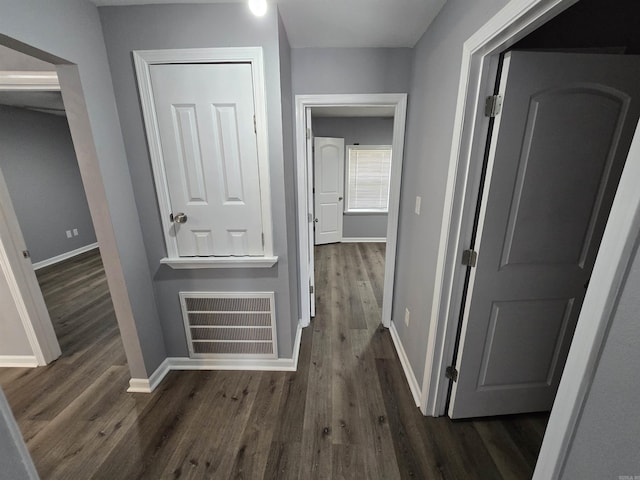 1903 W 24th Ave, Pine Bluff, AR 71603 - hallway featuring dark wood-type flooring and baseboards
