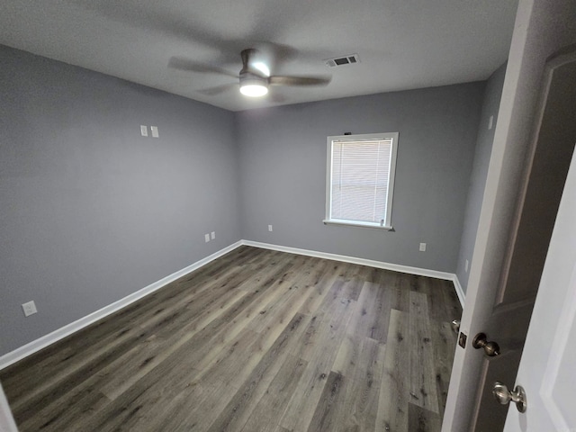 empty room featuring ceiling fan and wood-type flooring