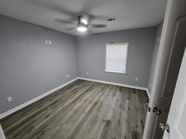 1903 W 24th Ave, Pine Bluff, AR 71603 - empty room with ceiling fan, dark wood-style floors, and baseboards
