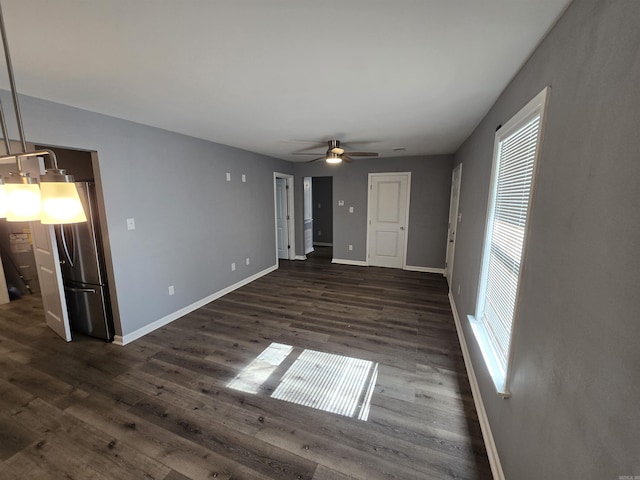 1903 W 24th Ave, Pine Bluff, AR 71603 - unfurnished living room with baseboards, dark wood-type flooring, and a ceiling fan