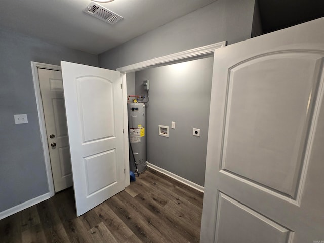 laundry area with electric dryer hookup, water heater, hookup for a washing machine, and dark wood-type flooring