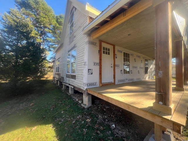 view of side of home featuring a porch