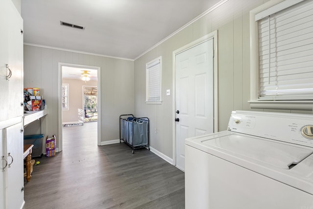 washroom with hardwood / wood-style floors, washer / dryer, and ornamental molding