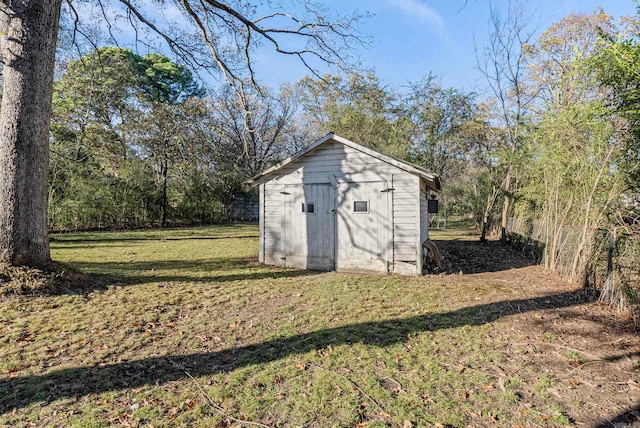 view of outdoor structure with a yard