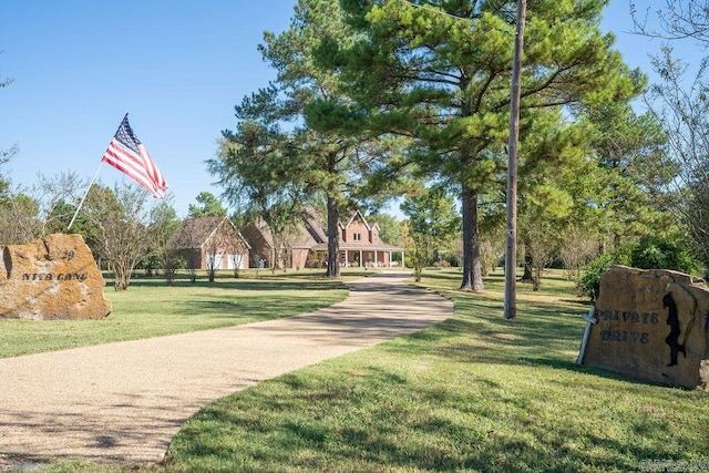 view of home's community with a lawn