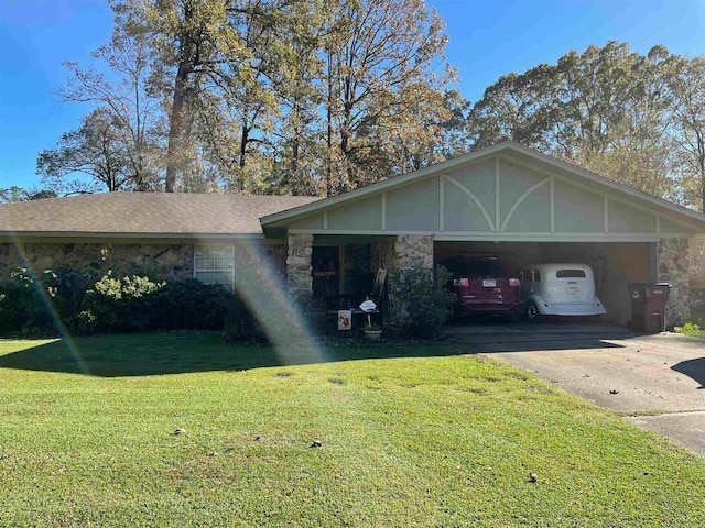 view of front of house featuring a garage and a front lawn