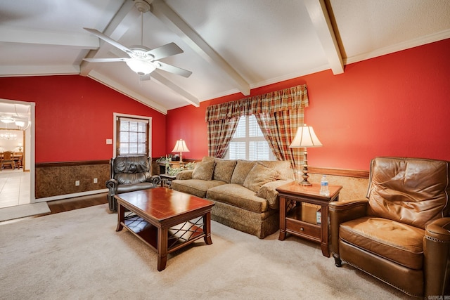 living room featuring ceiling fan, lofted ceiling with beams, and wood-type flooring