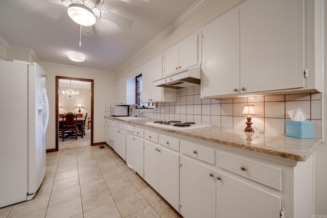 kitchen with white cabinets, white appliances, and sink