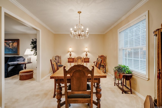 carpeted dining space featuring ornamental molding, a textured ceiling, and an inviting chandelier