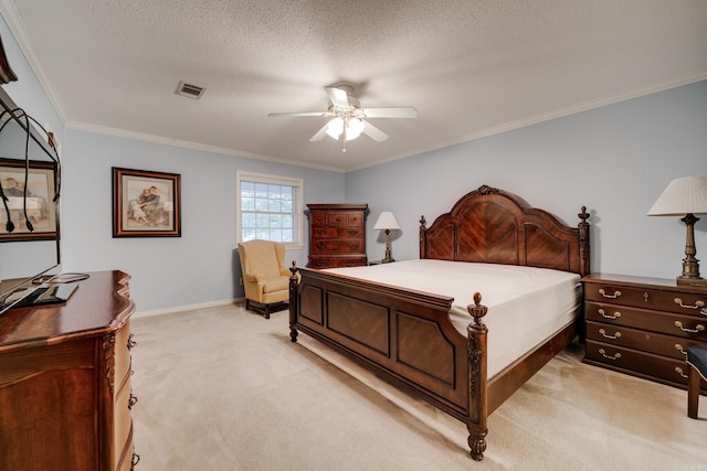 carpeted bedroom featuring a textured ceiling, ceiling fan, and crown molding