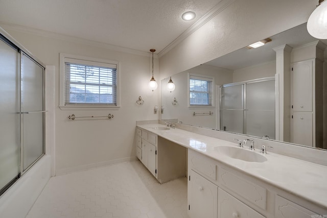 bathroom featuring vanity, shower / bath combination with glass door, tile patterned floors, crown molding, and a textured ceiling