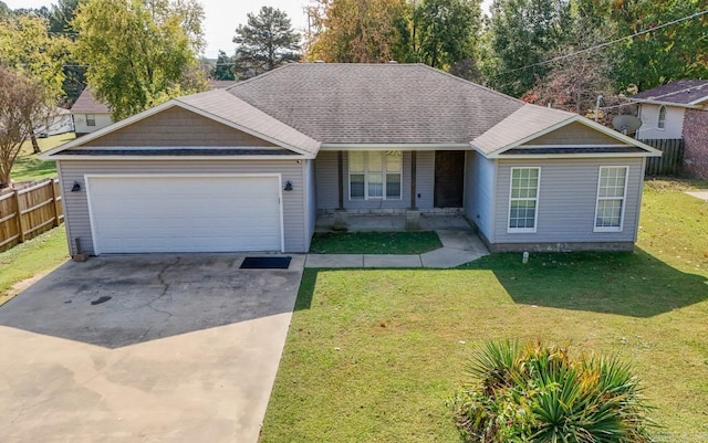 view of front of home with a garage and a front lawn