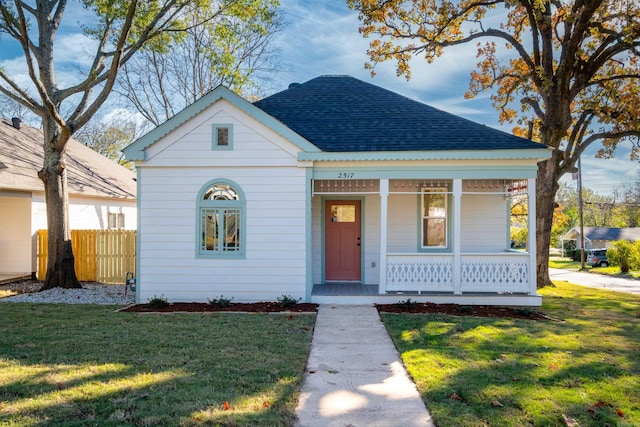 bungalow-style house with a front yard and a porch