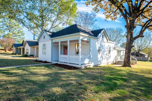 view of front of home with a front yard and a porch