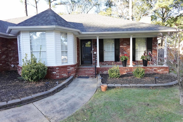 ranch-style house with covered porch