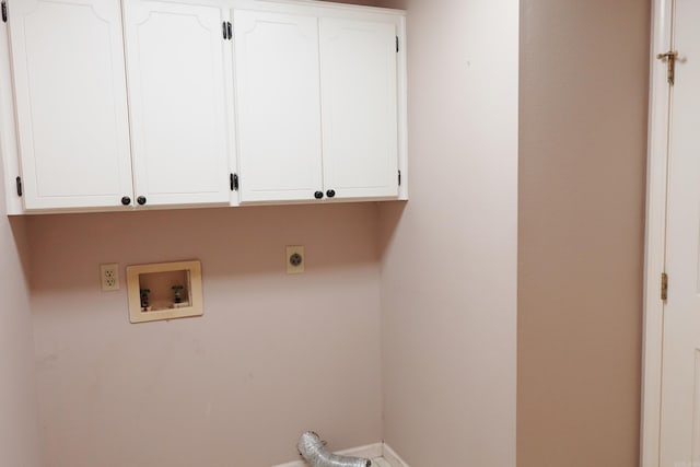 clothes washing area featuring hookup for an electric dryer, hookup for a washing machine, and cabinets