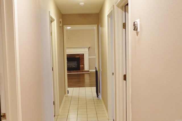 corridor with light hardwood / wood-style floors