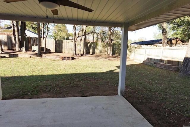 view of yard with a patio and ceiling fan