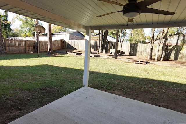 view of yard featuring a patio and ceiling fan