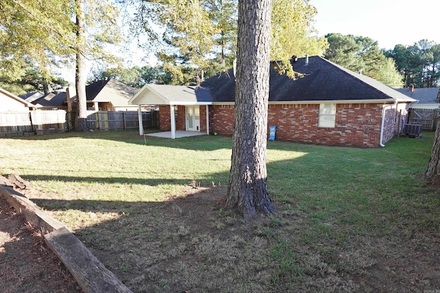 view of yard featuring a patio area and central AC