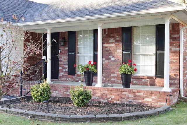 entrance to property featuring a porch