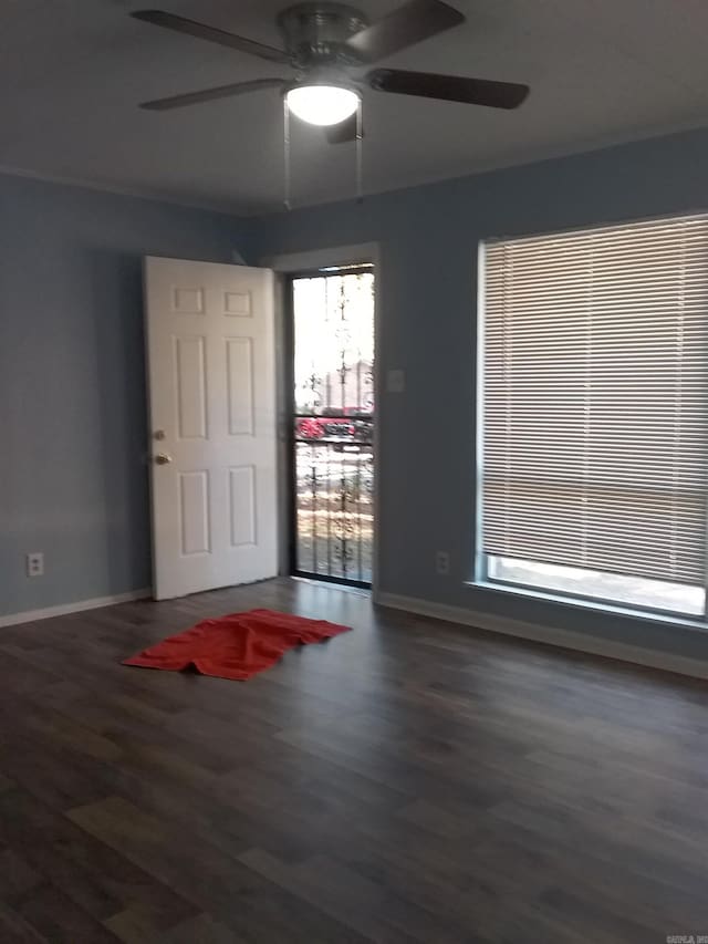 unfurnished room with hardwood / wood-style flooring and ceiling fan