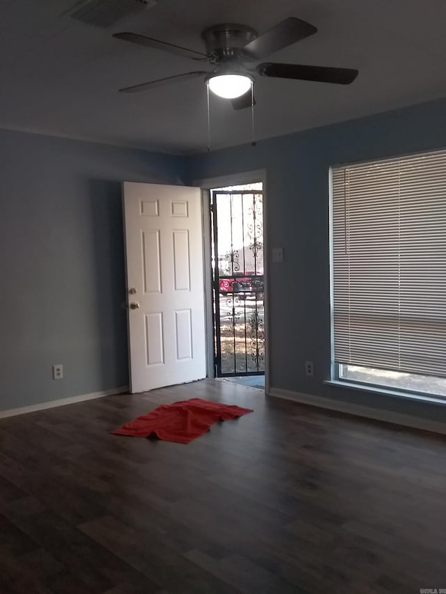 spare room with ceiling fan and hardwood / wood-style flooring