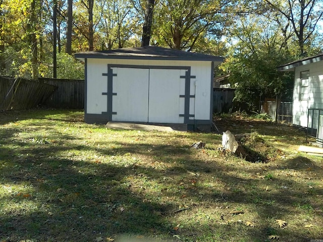 view of outbuilding with a yard