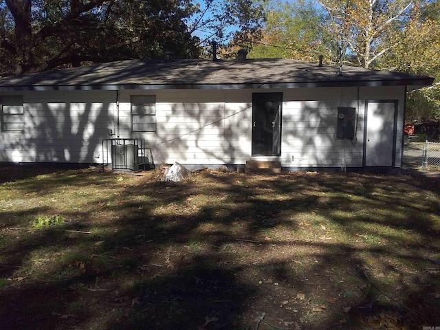 exterior space with a yard and cooling unit