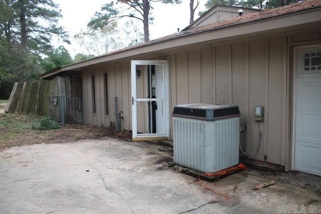 view of exterior entry with central AC unit