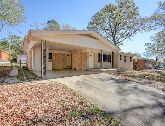 view of front of home featuring a porch and a carport