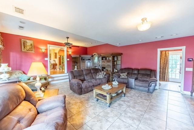 tiled living room featuring ceiling fan