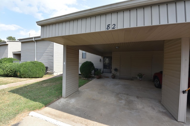 view of car parking featuring a yard and a carport