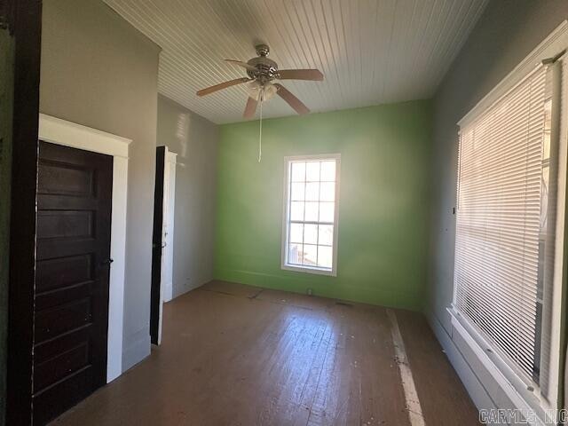 unfurnished room featuring hardwood / wood-style flooring and ceiling fan