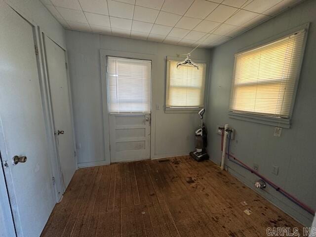 doorway with hardwood / wood-style flooring