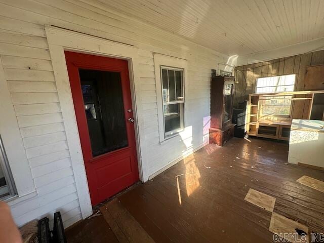 view of exterior entry featuring a porch