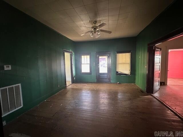 spare room featuring hardwood / wood-style flooring and ceiling fan