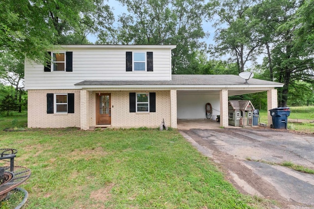 view of property featuring a carport and a front yard