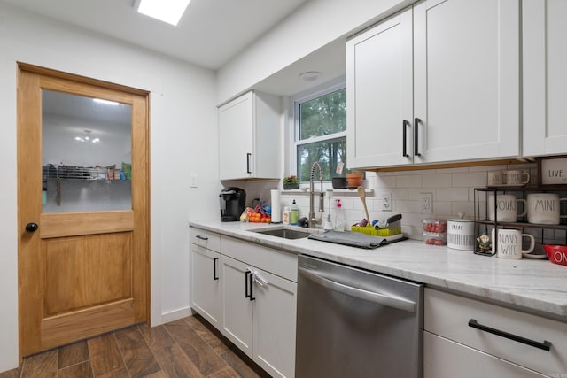 kitchen featuring dark hardwood / wood-style flooring, dishwasher, white cabinets, and sink