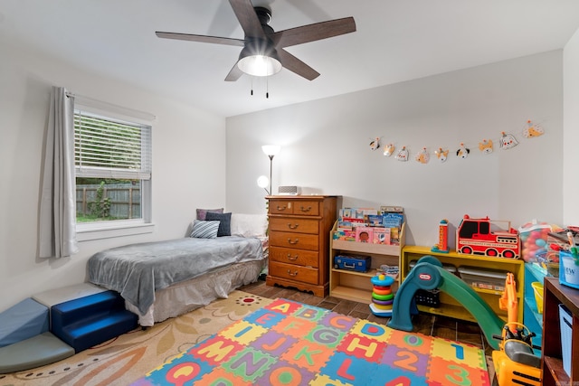 bedroom featuring hardwood / wood-style floors and ceiling fan