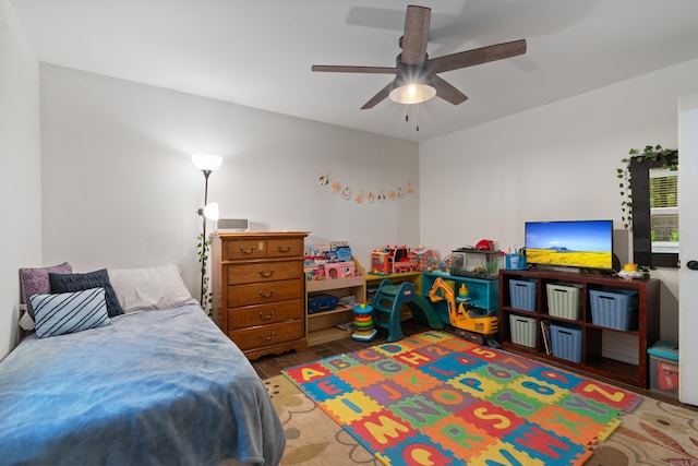 bedroom featuring hardwood / wood-style floors and ceiling fan