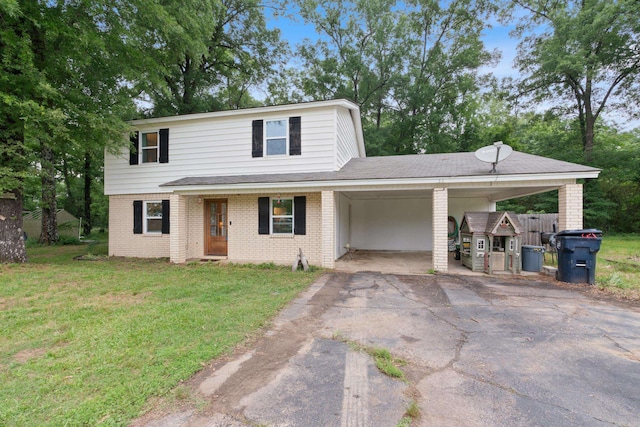 front of property with a front yard and a carport