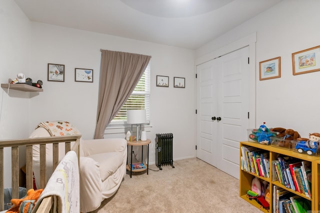 carpeted bedroom with radiator heating unit