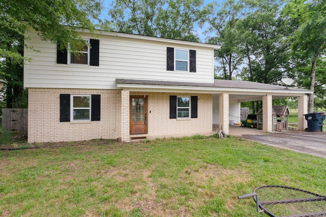 view of front property featuring a front lawn and a carport