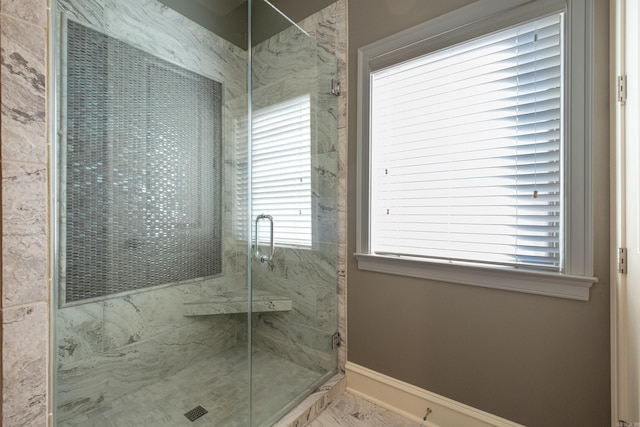 bathroom featuring an enclosed shower